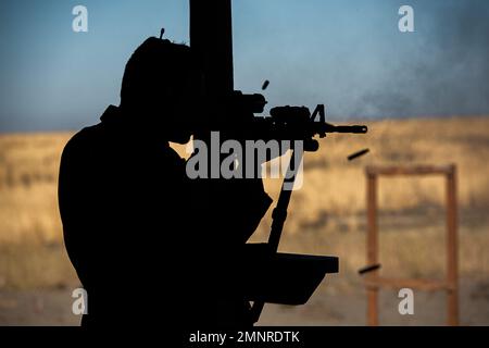 Col. Isaac T. Bell, 366th Fighter Wing Deputy commander, fires a M4 carbine at the off-base shooting range on Oct. 5, 2022 outside of Mountain Home Air Force Base, Idaho. Airmen must undergo routine weapons qualification training to ensure safety and proficiency standards. Stock Photo