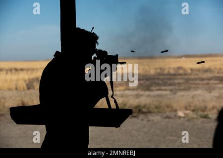 Col. Isaac T. Bell, 366th Fighter Wing Deputy commander, fires a M4 carbine at the off-base shooting on Oct. 5, 2022 outside of Mountain Home Air Force Base, Idaho. Security forces Airmen must qualify annually on multiple weapons including the M4 carbine and Berretta M9 pistol. Stock Photo