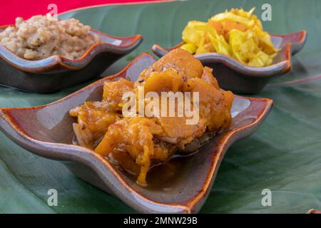 Ethiopian Spicy Pumpkin, Ethiopian Lentil Stew, Ethiopian cabbage, three Ethiopian vegetarian dishes angled side view Stock Photo