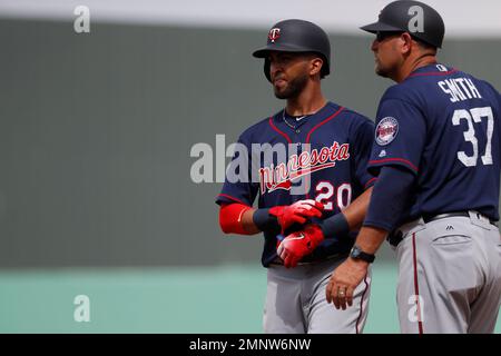 Minnesota Twins' Eddie Rosario stands on first base next to first