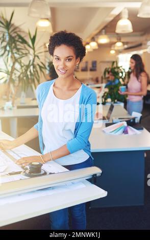 Its more than jost planning to me. Cropped portrait of a young architect working on her drafting table. Stock Photo