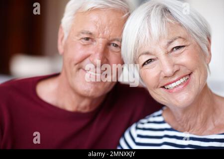 Still crazy about each other. Portrait of a loving senior couple at home. Stock Photo