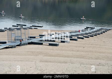 Lucky Peak Lake (Reservoir) on the Boise River drainage, SW Idaho, at critically low level (50% capacity) in early April 2022. Stock Photo