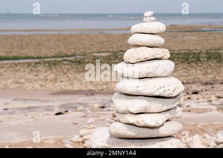 made of stone tower on the beach in zen pyramid Stock Photo