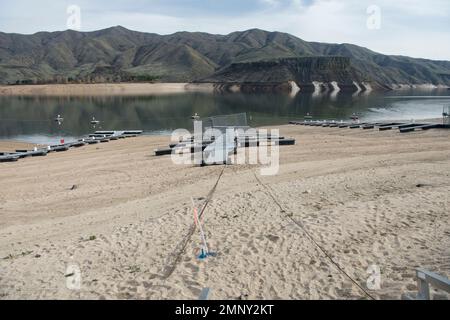 Lucky Peak Lake (Reservoir) on the Boise River drainage, SW Idaho, at critically low level (50% capacity) in early April 2022. Stock Photo