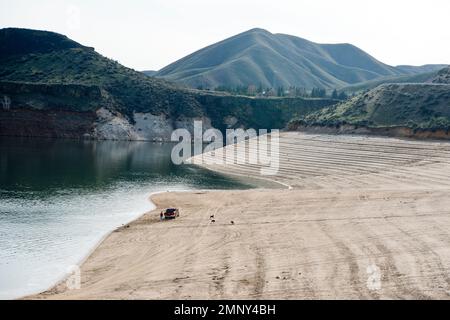 Lucky Peak Lake (Reservoir) on the Boise River drainage, SW Idaho, at critically low level (50% capacity) in early April 2022. Stock Photo