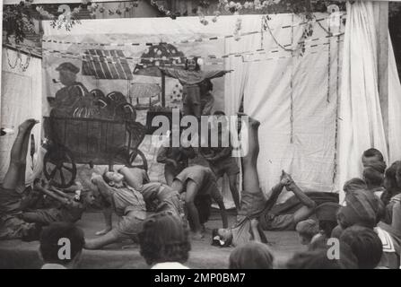 vintage moment / vintage funny moment / vintage photograph / power of the moment / magic moments /performance / vintage camp  acrobatics performance BY  scout girls at the 1930s / girls scout uniform / historical / youth organizations / scout camp / hungary Stock Photo