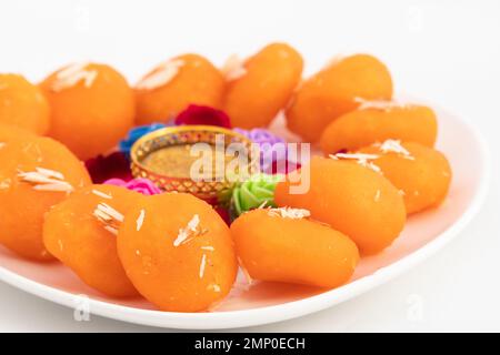 Indian Bengali Mithai Orange Kheer Mohan Also Called Khira Mohan, Santre Ki Kheer, Or Santra Khir Mohan Is Orange Color Softball made of Chena Balls, Stock Photo