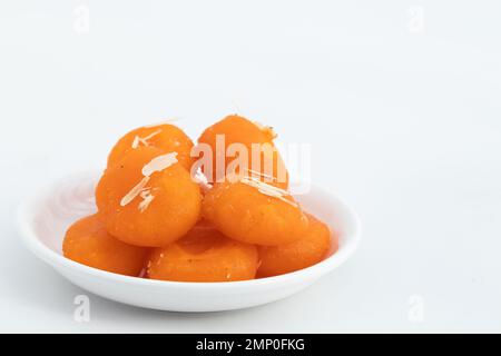 Indian Bengali Mithai Orange Kheer Mohan Also Called Khira Mohan, Santre Ki Kheer, Or Santra Khir Mohan Is Orange Color Softball made of Chena Balls, Stock Photo