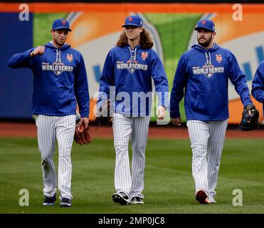 New York Mets pitchers Noah Syndergaard, Jacob deGrom and Matt Harvey (L to  R) walk in from the bullpen prior to playing the Los Angeles Dodgers in  game 4 of the NLDS