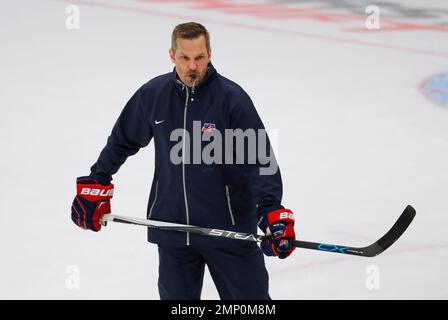 https://l450v.alamy.com/450v/2mp0m8m/file-in-this-march-30-2017-file-photo-united-states-coach-robb-stauber-skates-during-practice-in-preparation-for-the-iihf-womens-world-championship-hockey-tournament-in-plymouth-mich-stauber-cant-miss-seeing-the-olympic-rings-painted-at-center-ice-even-on-the-practice-rink-the-former-goalie-is-doing-his-best-to-ignore-all-the-reminders-that-he-is-making-his-head-coaching-debut-on-the-worlds-biggest-stage-for-womens-hockey-at-the-2018-winter-olympics-ap-photopaul-sancya-file-2mp0m8m.jpg