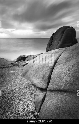 Rocks and clouds at beach in Geoffrey Bay on Magnetic Island Stock Photo
