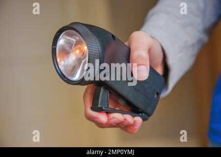Europe, Arnhem, Netherlands. Child with dyno torch flashlight. Stock Photo
