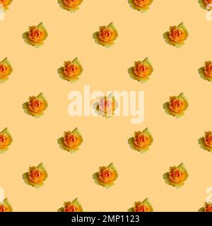 Seamless Pattern of Blossoming Yellow Rose on Peach Colored Background Stock Photo