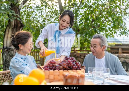 The whole family in the picnic Stock Photo