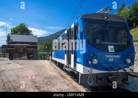 Queralbs station and engine of the Cogwheel railway Cremallera de Núria train in the Vall de Núria valley, Pyrenees, northern Catalonia, Spain, Europe Stock Photo