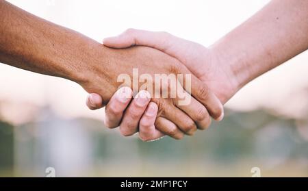 Closeup, handshake and support for sports, agreement and competition with collaboration, goal and target. Zoom, shaking hands or friends with Stock Photo