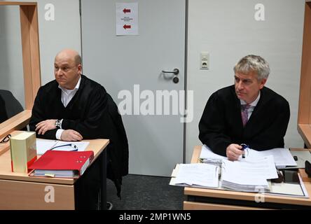Papenburg, Germany. 31st Jan, 2023. Lawyers Oliver Prinz (l) and Heiner Thölke (r), defense attorneys for the defendants, sit in the courtroom before the trial begins. In connection with animal welfare violations in a pig farm in Emsland, two defendants must answer to the Papenburg District Court. Credit: Lars Klemmer/dpa/Alamy Live News Stock Photo
