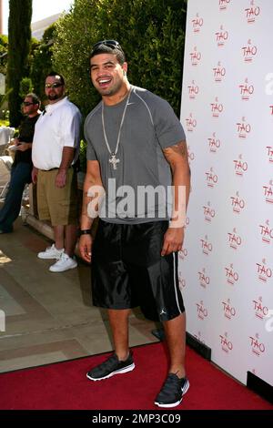 Celebrating the hottest pool party of 2008, Shawn Merriman poses for photographers before enjoying the many amenities that TAO Beach has to offer during the season kick-off at the Venetian. Las Vegas, NV. 4/12/08. Stock Photo