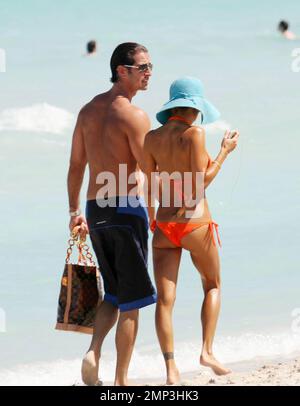 Exclusive!! Lorenzo Lamas' ex-wife Shauna Sand shows off her curves in the Miami heat today.  Reports are the Playboy Playmate and model has left LA to spend the summer in Miami and has reportedly angered Lamas in the process (the couple have three daughters together).  She spent the afternoon topping up her tan with Hawaiian Tropic oil in the company of a buff looking male friend before taking a stroll along the surf together.  Miami. FL, 4/23/08. Stock Photo