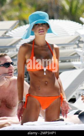 Exclusive!! Lorenzo Lamas' ex-wife Shauna Sand shows off her curves in the Miami heat today.  Reports are the Playboy Playmate and model has left LA to spend the summer in Miami and has reportedly angered Lamas in the process (the couple have three daughters together).  She spent the afternoon topping up her tan with Hawaiian Tropic oil in the company of a buff looking male friend before taking a stroll along the surf together.  Miami. FL, 4/23/08. Stock Photo