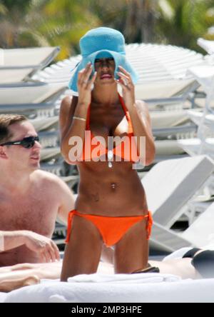 Exclusive!! Lorenzo Lamas' ex-wife Shauna Sand shows off her curves in the Miami heat today.  Reports are the Playboy Playmate and model has left LA to spend the summer in Miami and has reportedly angered Lamas in the process (the couple have three daughters together).  She spent the afternoon topping up her tan with Hawaiian Tropic oil in the company of a buff looking male friend before taking a stroll along the surf together.  Miami. FL, 4/23/08. Stock Photo