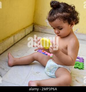 Cute little boy Shivaay Sapra at home balcony during summer time, Sweet little boy photoshoot during day light, Little boy enjoying at home during pho Stock Photo