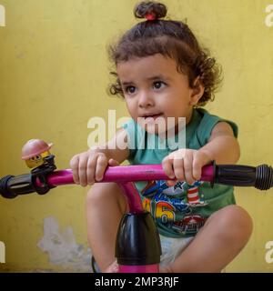 Cute little boy Shivaay Sapra at home balcony during summer time, Sweet little boy photoshoot during day light, Little boy enjoying at home during pho Stock Photo