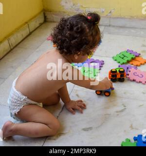 Cute little boy Shivaay Sapra at home balcony during summer time, Sweet little boy photoshoot during day light, Little boy enjoying at home during pho Stock Photo