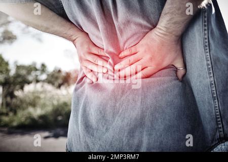 Hands, sports fitness and man with back injury outdoors after accident or workout. Emergency, first aid and male with fibromyalgia, arthritis or Stock Photo
