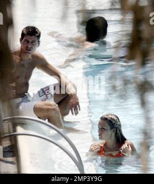 Alex Curran and Steven Gerrard lounge by the pool and take a dip to ...