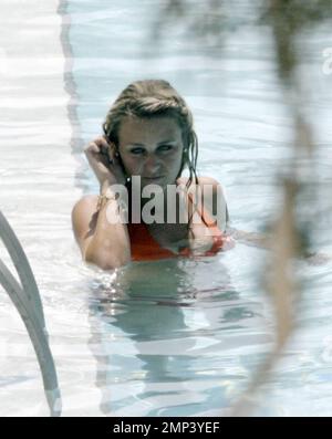 Alex Curran and Steven Gerrard lounge by the pool and take a dip to ...