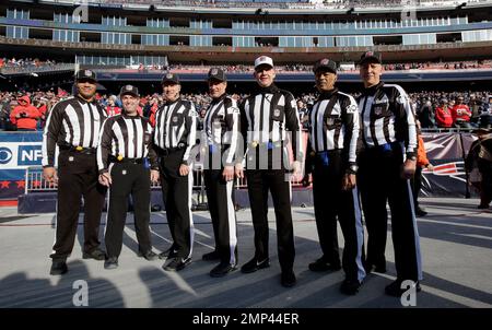 Referee Brad Rogers, left stands with replay official Durwood Manley before  an NFL football game between the Los Angeles Rams and the Las Vegas Raiders,  Thursday, Dec. 8, 2022, in Inglewood, Calif. (