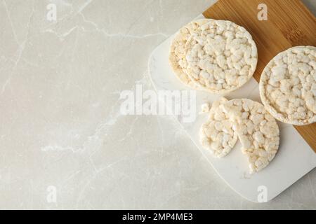 Puffed rice cakes on grey marble table, top view. Space for text Stock Photo