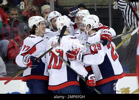 Washington Capitals celebrate a goal by Brett Connolly 10 during the first period of an NHL hockey game against the New Jersey Devils Thursday Jan. 18 2018 in Newark N.J. AP Photo Julio