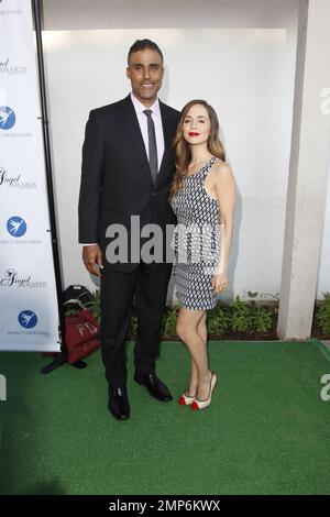 Rick Fox, left, and Eliza Dushku arrives at the Project Angel Food's 2013  Angel Awards on Saturday, August 10, 2013 in Los Angeles. (Photo by Richard  Shotwell/Invision/AP Stock Photo - Alamy