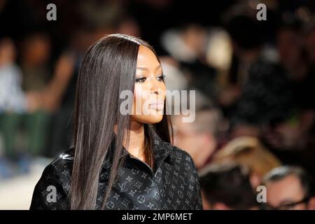 Model Naomi Campbell presents a creation from the Louis Vuitton