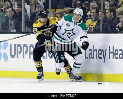 St. Louis Blues center Dakota Joshua (54) faces off against Dallas Stars  left wing Riley Tufte (27) during the second period of an NHL hockey game  on Friday, Dec. 17, 2021, in