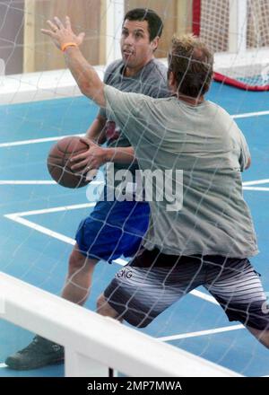 Actor Adam Sandler enjoys some downtime by playing basketball on the set of 'Jack and Jill', co-starring Katie Holmes.  Some scenes for the comedy were filmed aboard the world's largest cruise ship, Royal Caribbean's new Allure of the Seas. Fort Lauderdale, FL. 11/20/10. Stock Photo