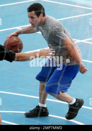 Actor Adam Sandler enjoys some downtime by playing basketball on the set of 'Jack and Jill', co-starring Katie Holmes.  Some scenes for the comedy were filmed aboard the world's largest cruise ship, Royal Caribbean's new Allure of the Seas. Fort Lauderdale, FL. 11/20/10. Stock Photo