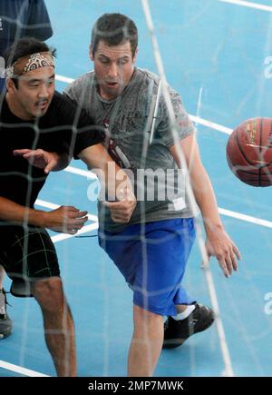 Actor Adam Sandler enjoys some downtime by playing basketball on the set of 'Jack and Jill', co-starring Katie Holmes.  Some scenes for the comedy were filmed aboard the world's largest cruise ship, Royal Caribbean's new Allure of the Seas. Fort Lauderdale, FL. 11/20/10. Stock Photo