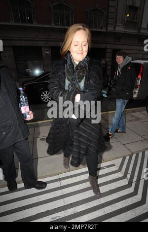 Singer Adele (aka Adele Adkins) arrives, big water bottle in hand, at the studios of BBC Radio where she promoted her upcoming second studio album '21'.  The Grammy Award winner appeared to have driven herself and gave a modest smile as she walked inside where she performed a live session on the Dermot O'Leary show. London, UK. 01/22/11. Stock Photo