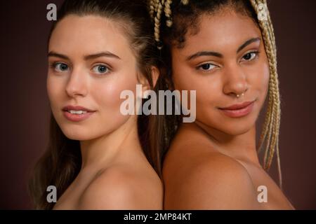 Premium Photo  Beauty diversity and body positivity with a woman friends  together in studio on a brown background for inclusion portrait model and  underwear with a female friend group standing proud