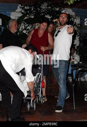 Super model Alessandra Ambrosio, fiance Jamie Mazur and their baby girl Anja Mazur enjoy a family dinner out at Taverna Tony. The happy couple walked in ahead of their daughter, who was sleeping while being pushed by a nanny in her stroller. Los Angeles, CA. 7/19/09. . Stock Photo