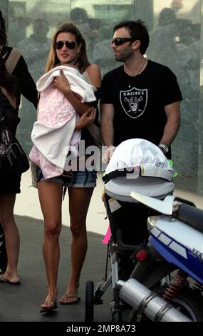 Exclusive!! Supermodel Alessandra Ambrosio with longtime boyfriend Jamie Mazur and 3 month old daughter Anja Louise Ambrosio Mazur in Miami Beach during the opening weekend for the new Fonatainebleau Hotel, 11/16/08. Stock Photo