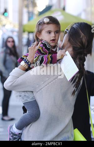 victorias secret model alessandra ambrosio who is six months pregnant with her second child with fiance jamie mazur was seen out and about in beverly hills with the couples 3 year old daughter anja louise the 30 year old brazilian model wore a white blue tie dye top blue jeans white sneakers hair up in a loose braid with a florescent green purse and sunglasses los angeles ca 1st march 2012