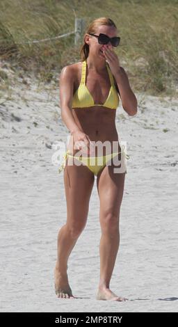 'Strictly Come Dancing' Russian dancer, Aliona Vilani soaks up the sun with friends showing off her toned body in a yellow string bikini whilst on a birthday getaway. Vilani turned 28 years old on Tuesday and decided to get some much needed rest with her relatives in Florida. The professional dancer has been working hard getting herself fit for the next series of 'Strictly Come Dancing' which has paid off and can clearly be seen as she taunts her body on the beach. Miami Beach, FL. 3rd of May, 2012. . Stock Photo