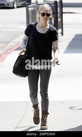 Actress Amanda Seyfried smiles for the cameras as she strolls after