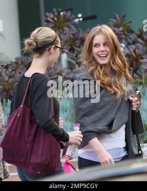 Actress Amy Adams chats with a friend as she leaves the studios of 'Chelsea Lately' after appearing on the program. Adams can currently be seen in the Golden Globe nominated film 'The Fighter' co-starring Christian Bale and Mark Wahlberg.  Los Angeles, CA. 12/16/10. Stock Photo
