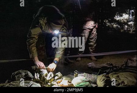 A Soldier participates in physical tryouts, completing a ruck march ...